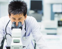 medical technologist is working in the laboratory. Using a microscope for detect the objects that are too small for the naked eye. Picture for concept such as hospital, doctor, health and science.